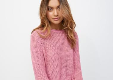 Girl wearing a knitted pink jumper