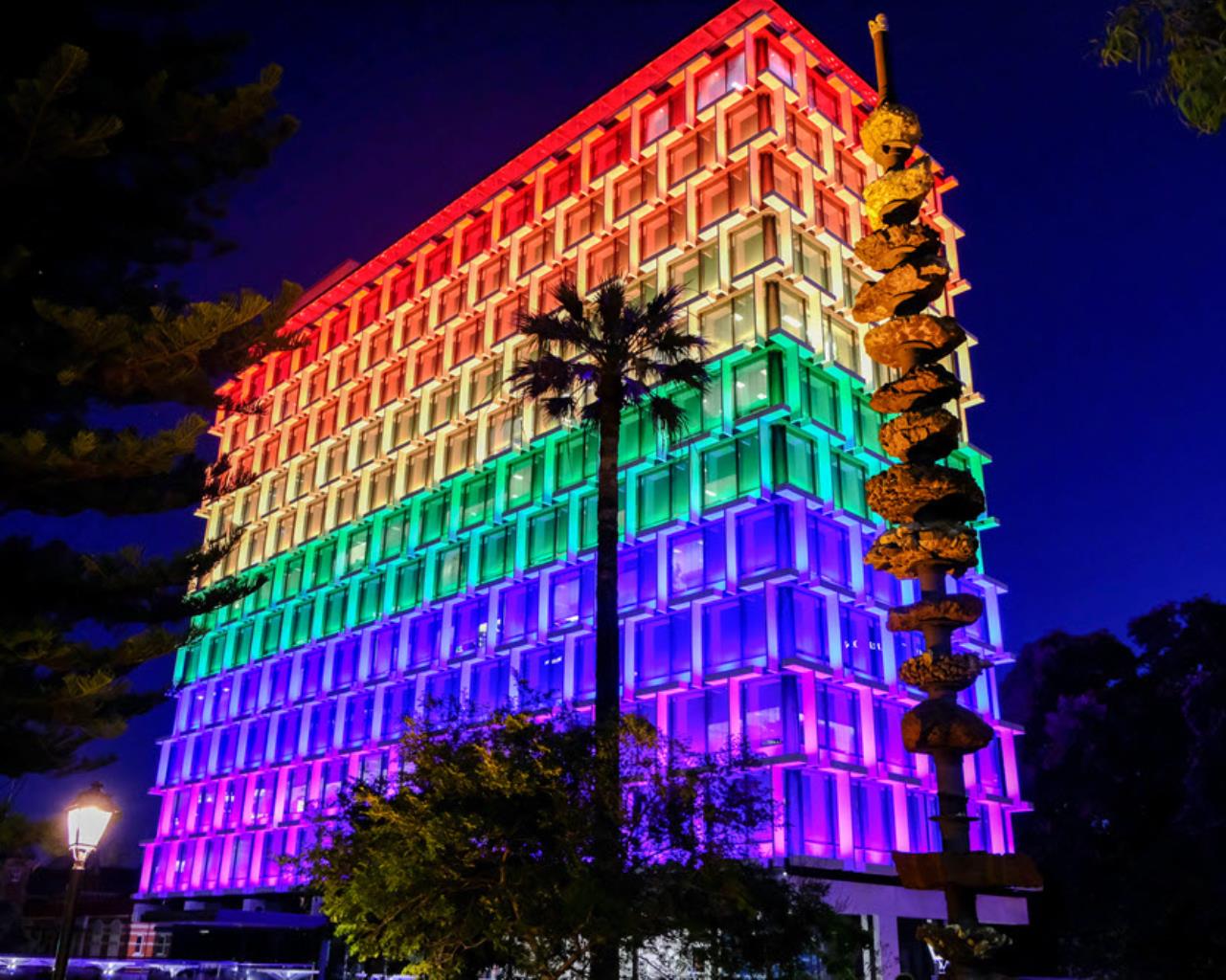 Council House building lit up in rainbow pride colours
