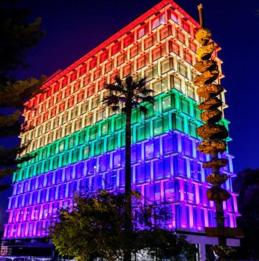 Council House building lit up in rainbow pride colours