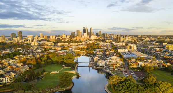 Aerial shot of Claisebrook Cove in East Perth showing water, bridges, gardens and City in the background