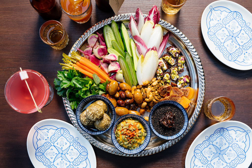 Overhead view of platter with vegetables and condiments