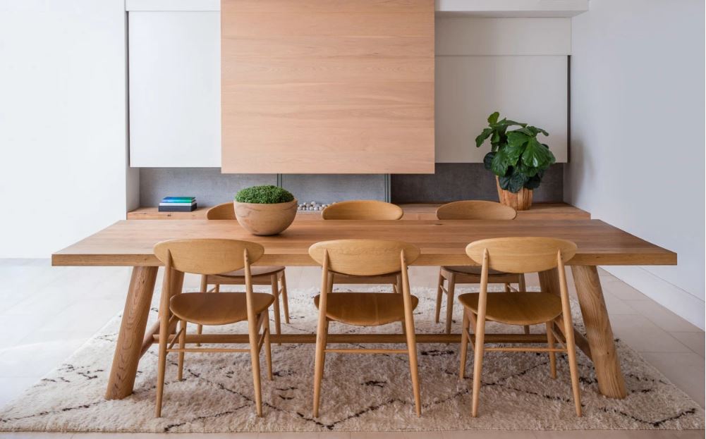 Wooden dining table and chairs in dining room