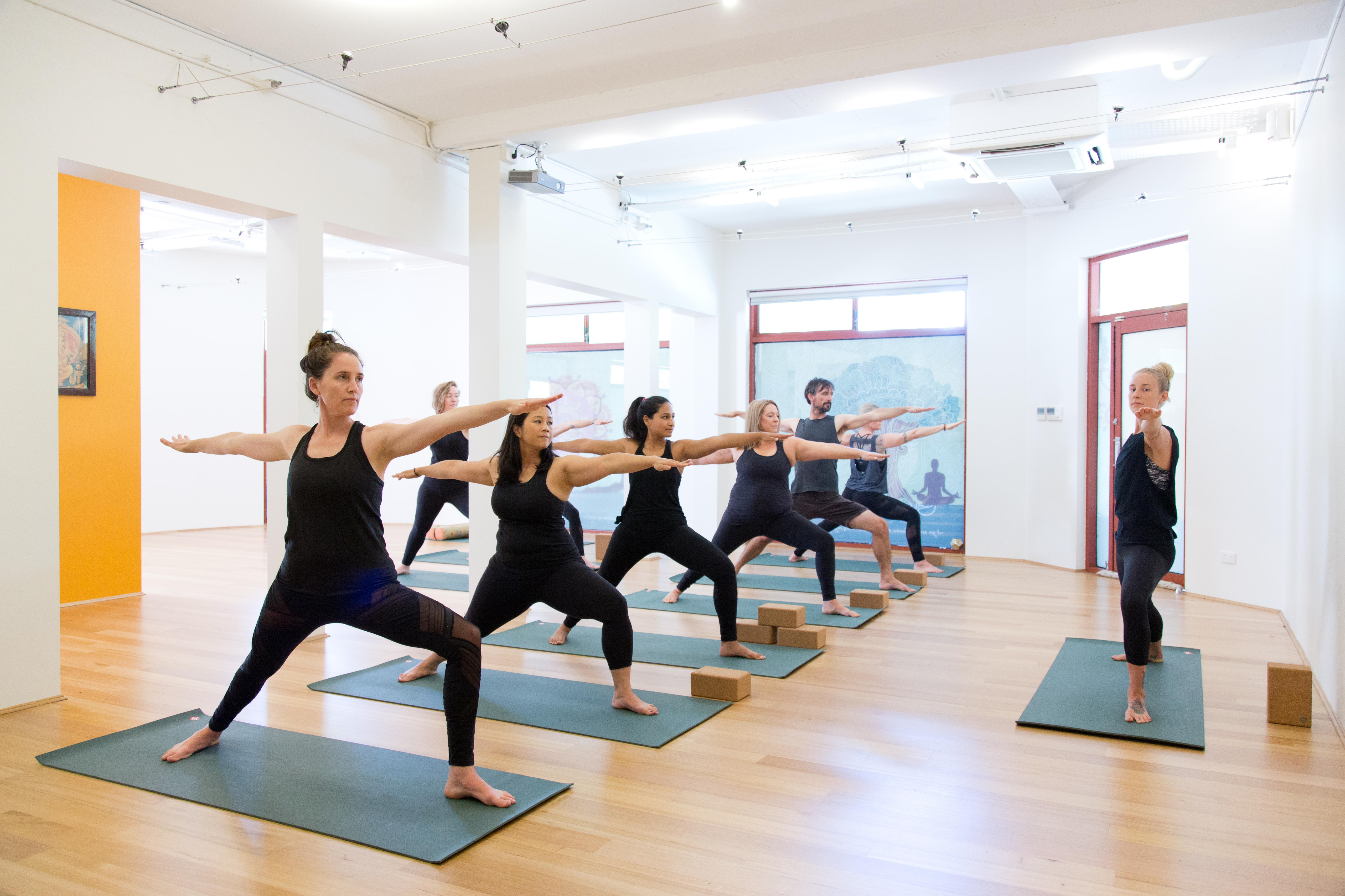 People participating in The Yoga Space's yoga class
