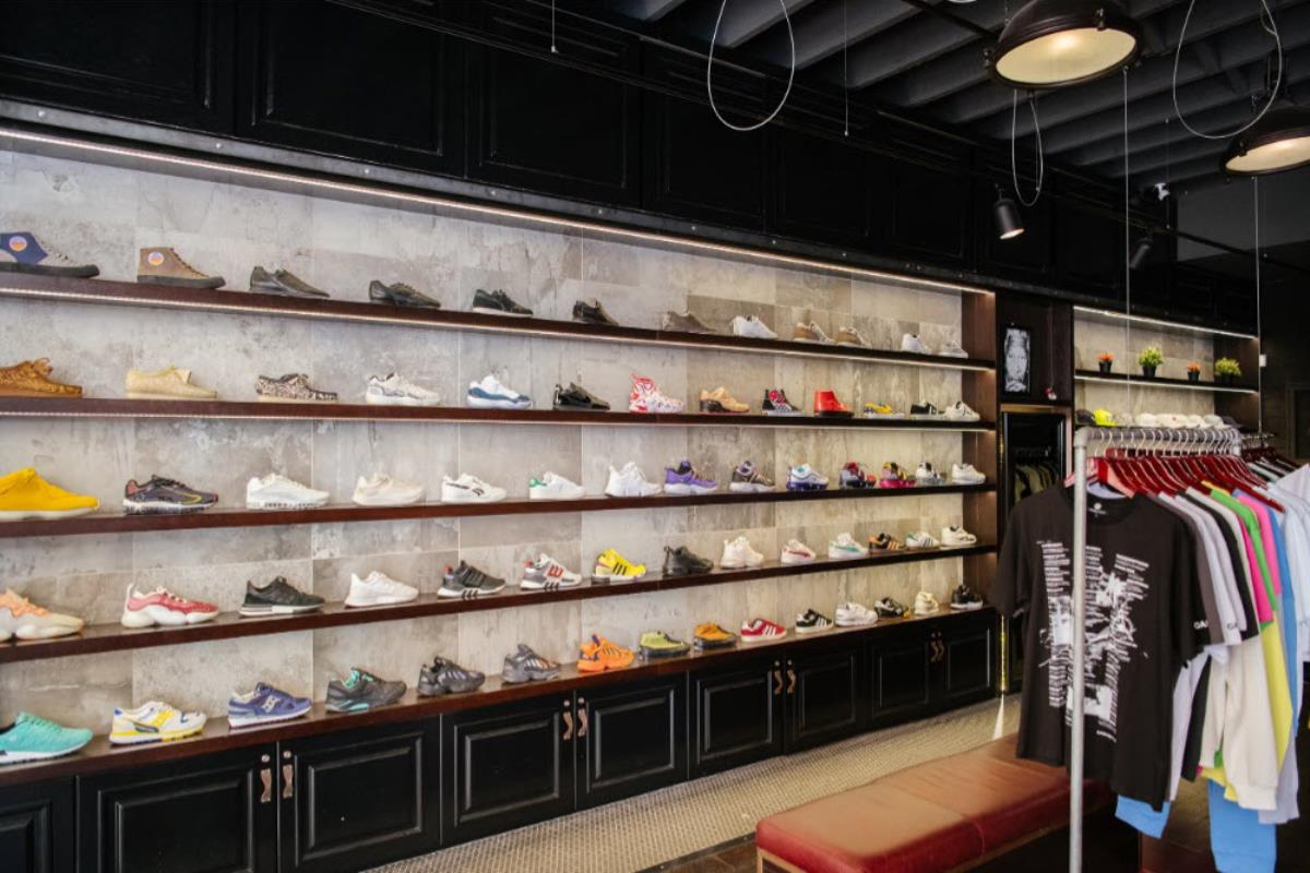 Insterior store shot with full wall of sneakers on display