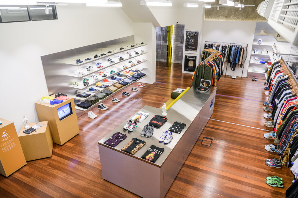 High angle view of interior of store showing shoes and clothing