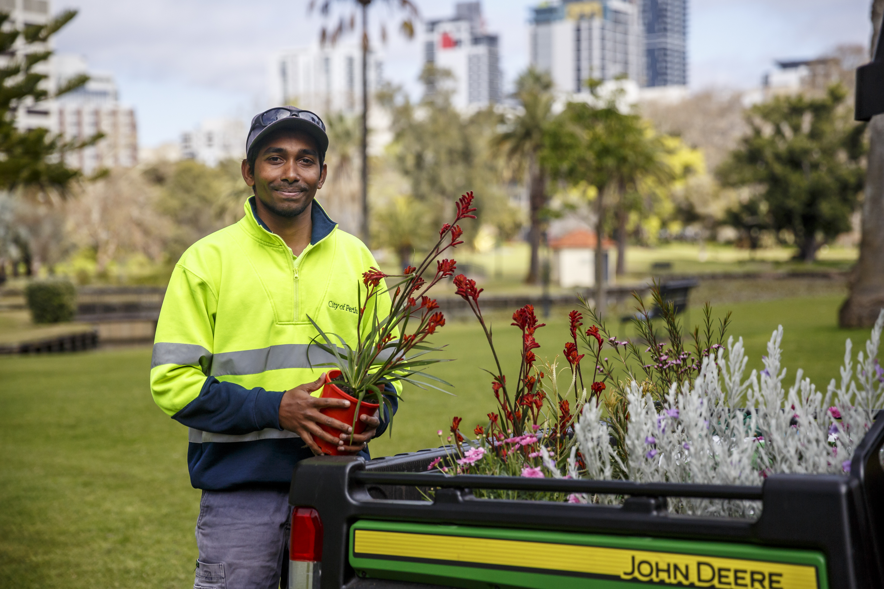 City of Perth Parks and Gardens staff member holds kangaroo paw
