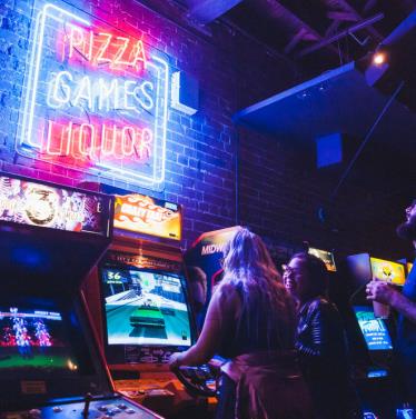 Game screens and neon signs