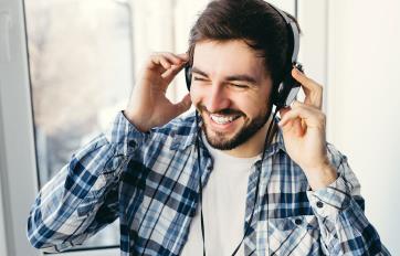 Young man listening on headphones