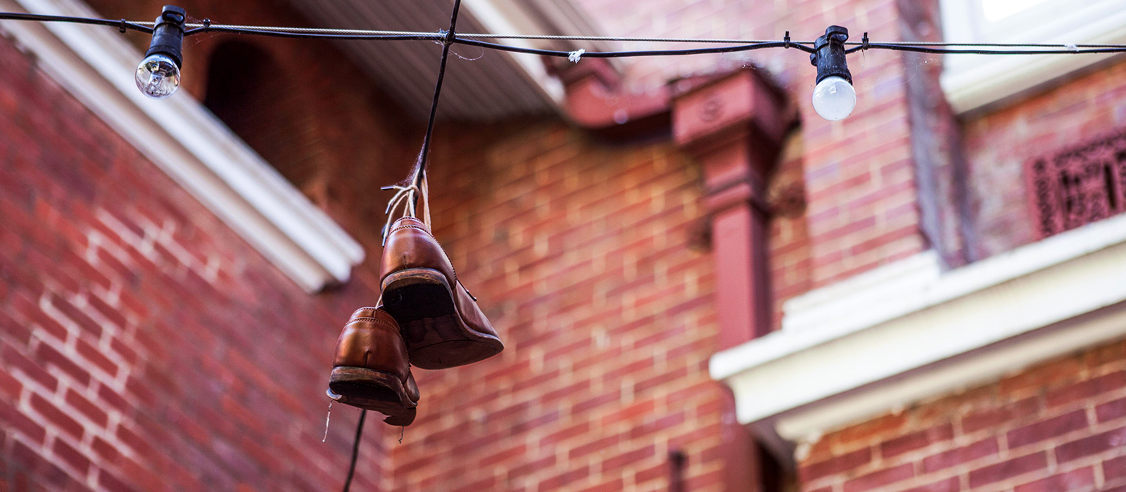 Shoes hanging from electrical wire