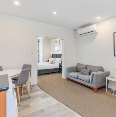 Lounge and Bedroom from kitchen - Superior Two Bedroom Serviced Apartment - All Suites Perth