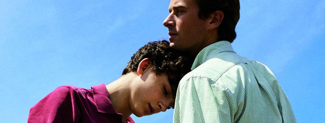 Image of one character with his head on the other characters chest, from Call Me By Your Name