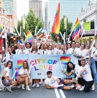 City of Perth staff members posing with City of Love banner at Pride Parade 2019